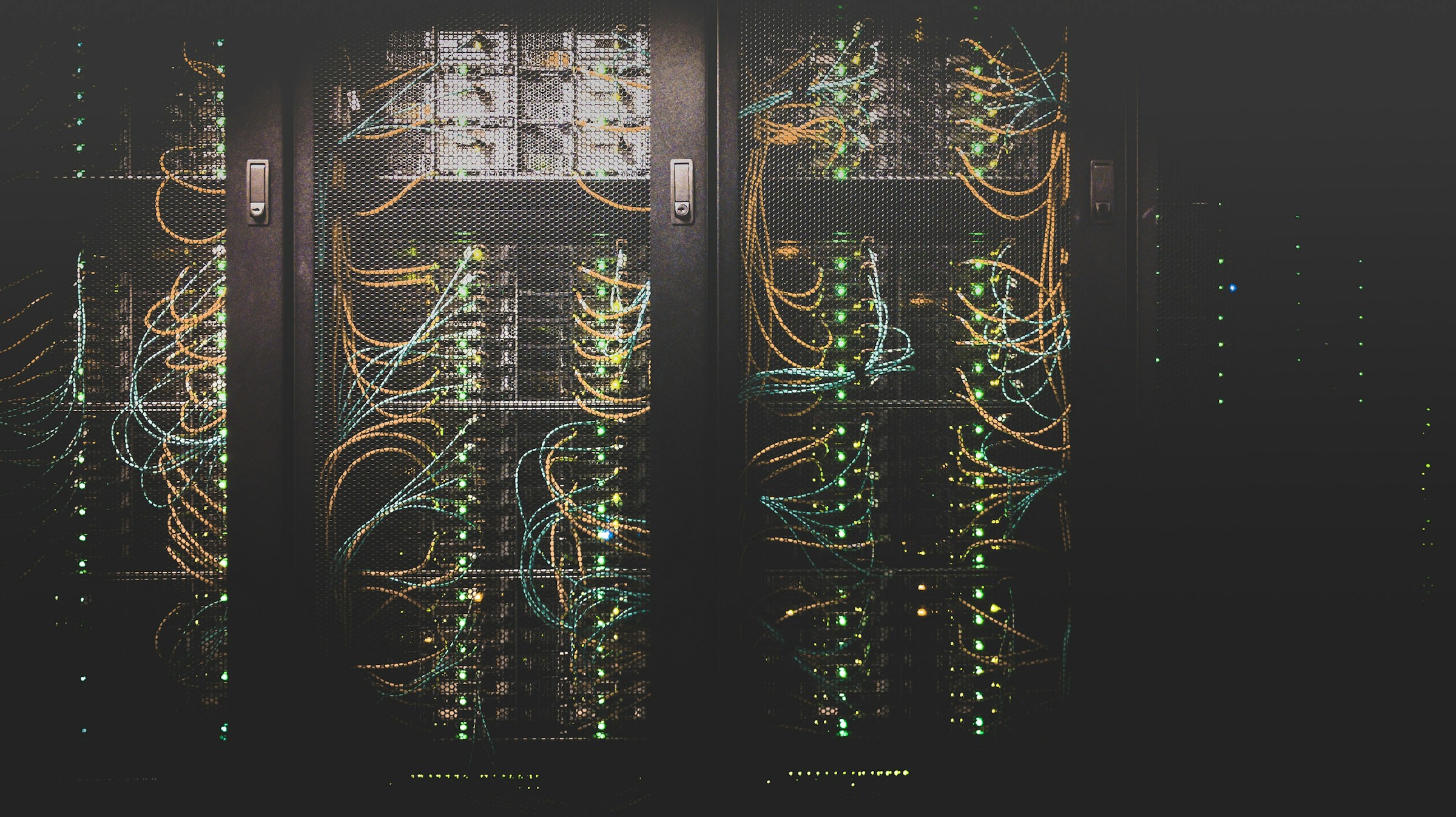 Enterprise data center — multiple rack cabinets with structured fiber cabling